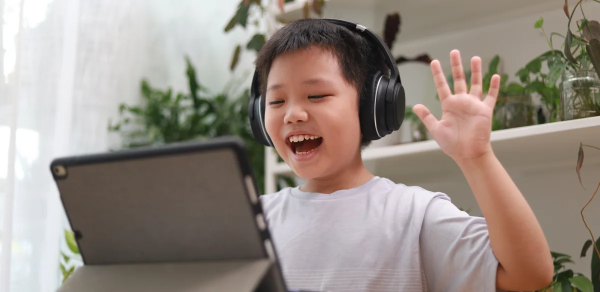 boy waving