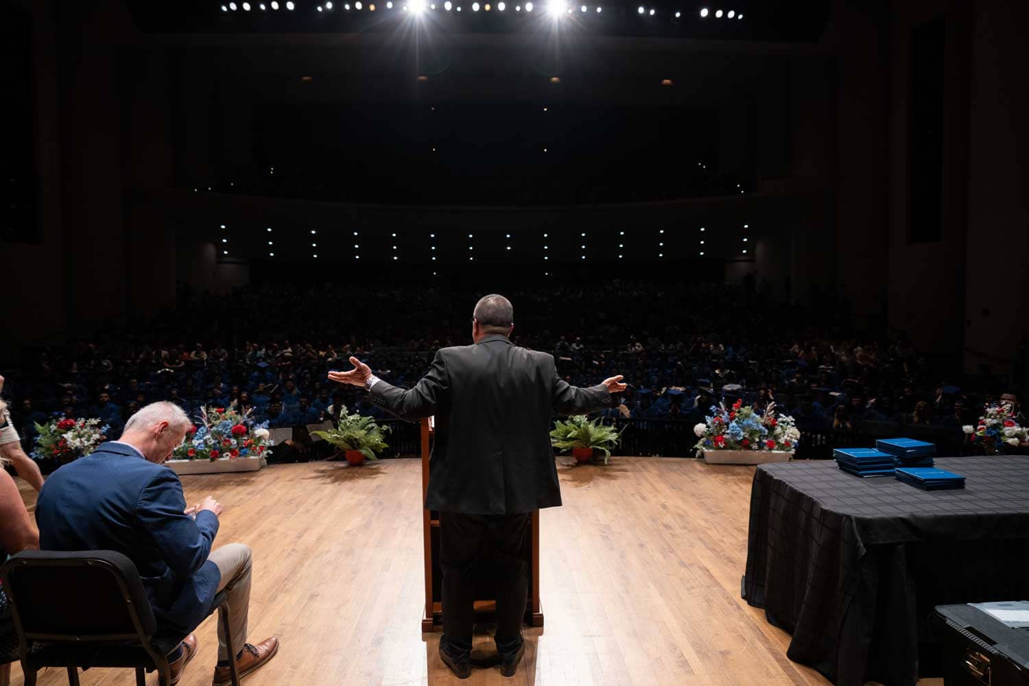 man speaking at graduation