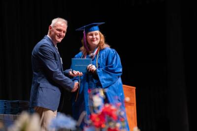 girl student receiving the diploma