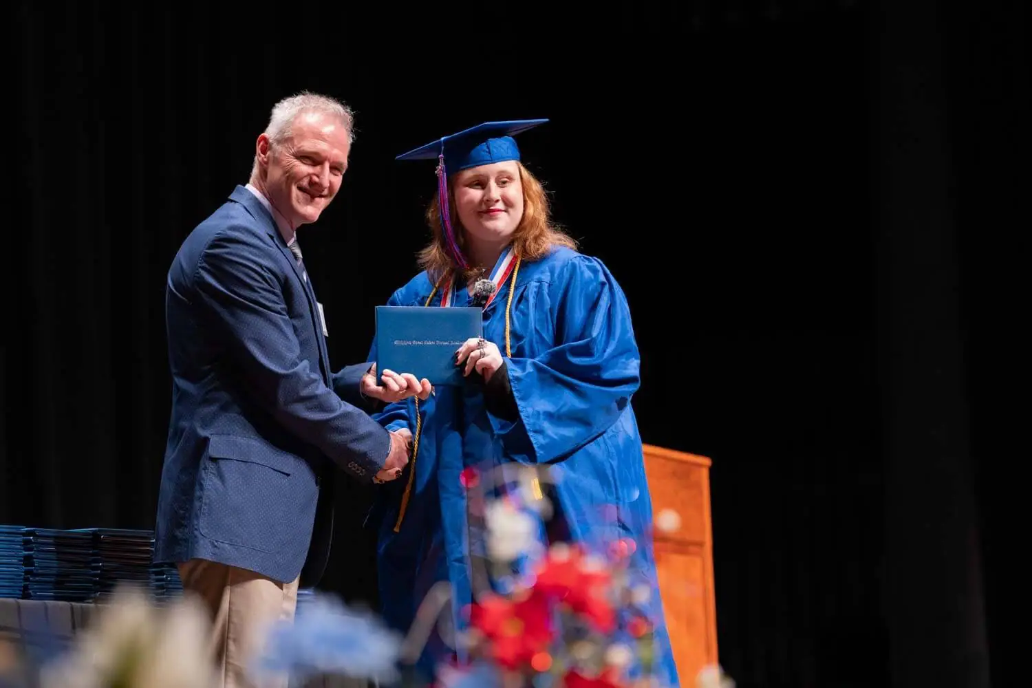 girl student receiving the diploma