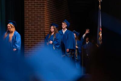 students receiving diplomas