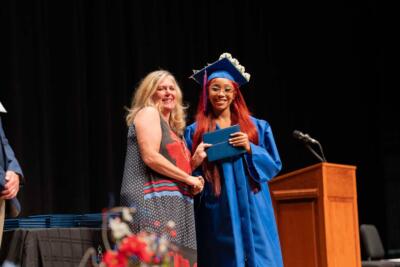 student receiving diploma